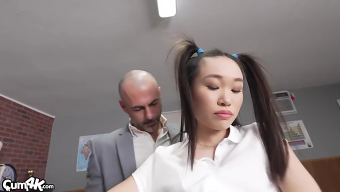 Small booby Asian schoolgirl gets teacher’s attention by playing with her pussy in detention.